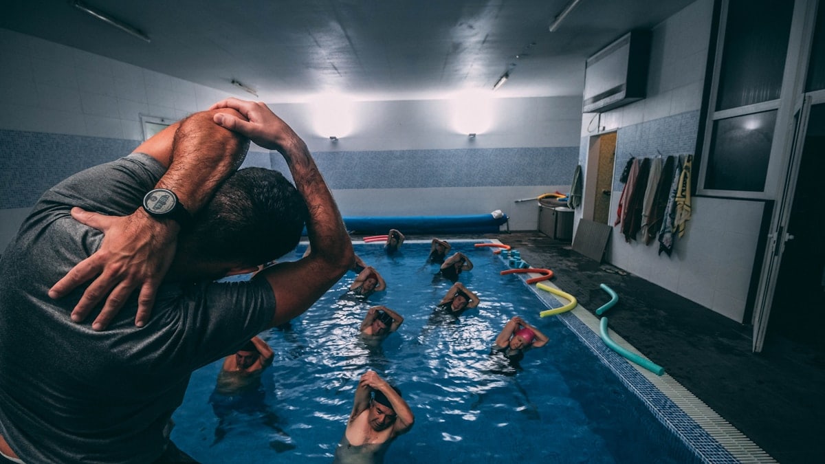 people stretching inside pool room