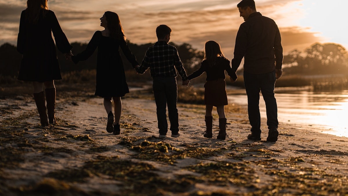 Family walk at sunset
